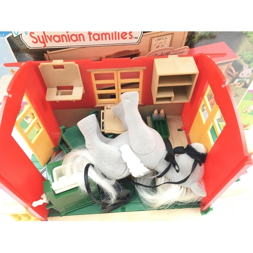 618 - 2 Boxed Sylvanian Families Playsets. A Caravan Roulotte and a Bakery Boulangerie.