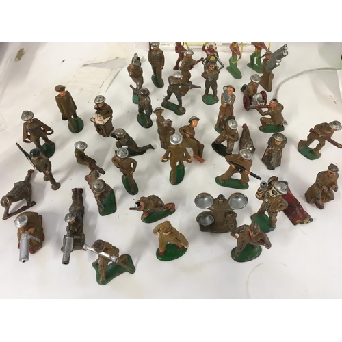 66 - A collection in excess of 40 model figures mainly soldiers No manufacturers marks other than some st... 