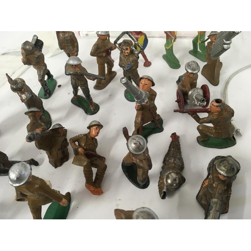 66 - A collection in excess of 40 model figures mainly soldiers No manufacturers marks other than some st... 