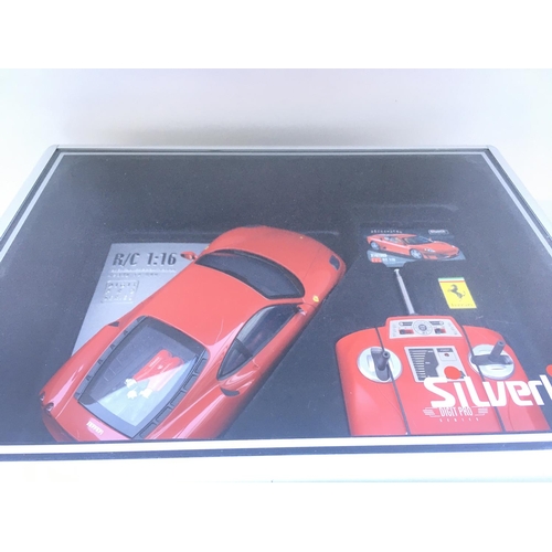 669 - A Silverlit Remote Controlled Digit Pro Series Ferrari in lockable Case. 1:16 Scale.