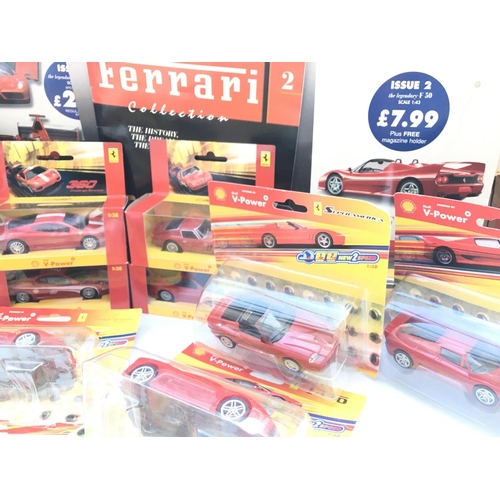 673 - A Collection of Shell power Ferraris. Magazines and Keyrings.