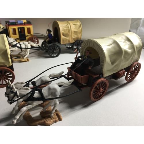 700 - A collection of five Timpo Western horse and wagons. Includes fire wagon..Wells Fargo wagon..Chuck W... 