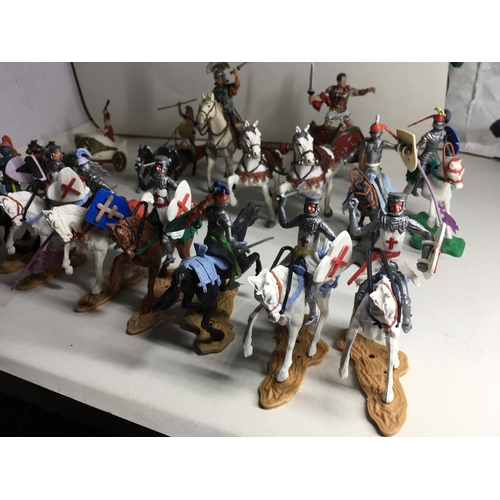 701 - Collection of plastic models by Britains. Cherilea and others. Includes 13 mounted knights. A mounte... 