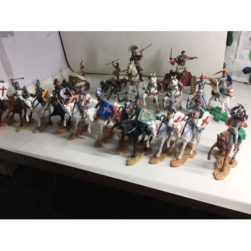 701 - Collection of plastic models by Britains. Cherilea and others. Includes 13 mounted knights. A mounte... 