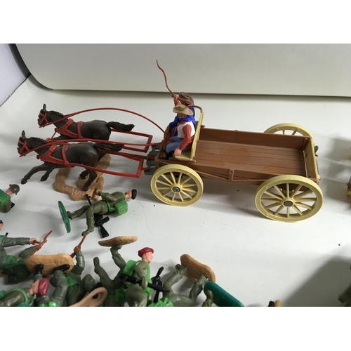 704 - A collection of Timpo plastic figures and vehicles themed in Wild West and WWII