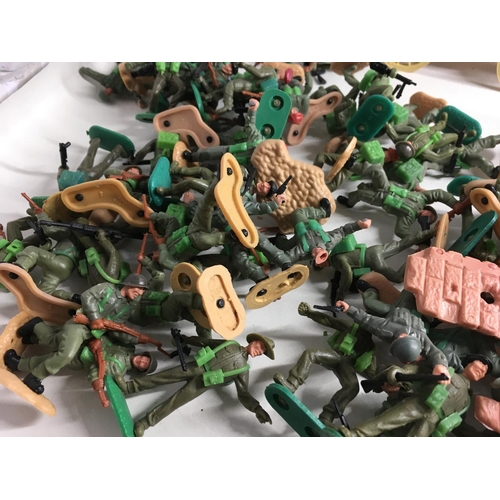 704 - A collection of Timpo plastic figures and vehicles themed in Wild West and WWII