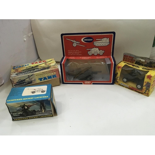 705 - Vintage boxed toys including a tin tank. 2x Artillery guns and a mobile rocket launcher.