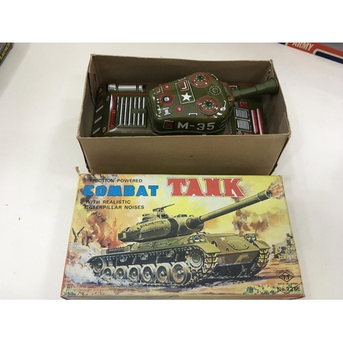 705 - Vintage boxed toys including a tin tank. 2x Artillery guns and a mobile rocket launcher.