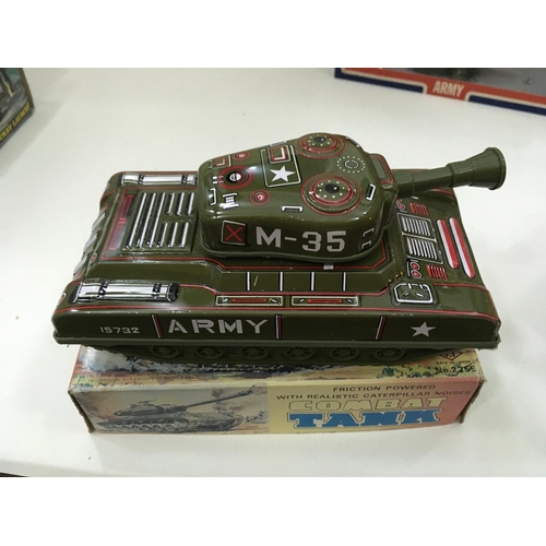 705 - Vintage boxed toys including a tin tank. 2x Artillery guns and a mobile rocket launcher.