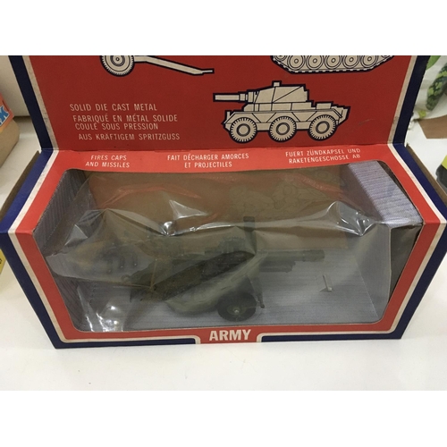 705 - Vintage boxed toys including a tin tank. 2x Artillery guns and a mobile rocket launcher.