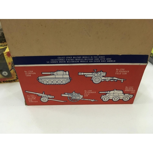 705 - Vintage boxed toys including a tin tank. 2x Artillery guns and a mobile rocket launcher.