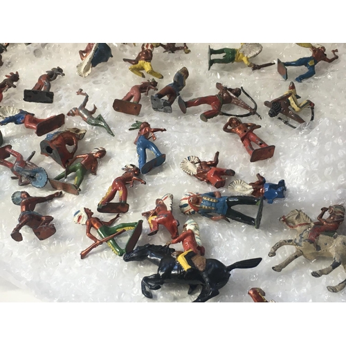 710 - A collection in excess of 70 metal figures by Britains and others. Themed as western Indians.