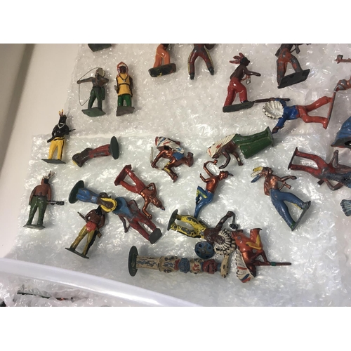 710 - A collection in excess of 70 metal figures by Britains and others. Themed as western Indians.