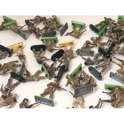 711 - A collection in excess of 60 plastic toy soldiers mainly Britains Deetail WWII and later.