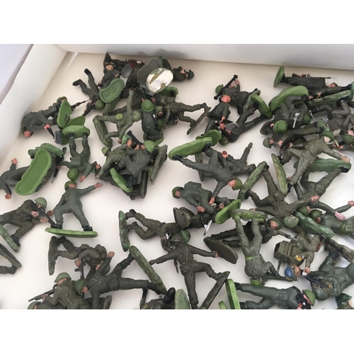 713 - A collection of approximately 100 pieces of model plastic soldiers by Britains and others. Themed WW... 