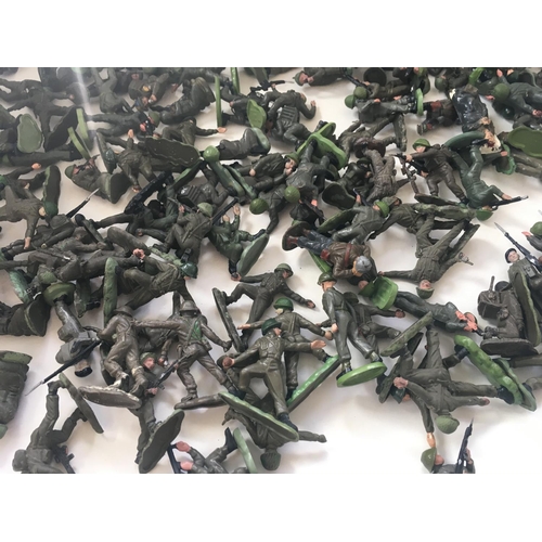 713 - A collection of approximately 100 pieces of model plastic soldiers by Britains and others. Themed WW... 