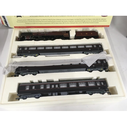 72 - A boxed Hornby set THE ROYAL TRAIN R2370 includes locomotive and tender together with three coaches.... 