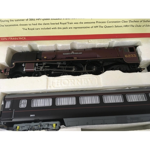 72 - A boxed Hornby set THE ROYAL TRAIN R2370 includes locomotive and tender together with three coaches.... 