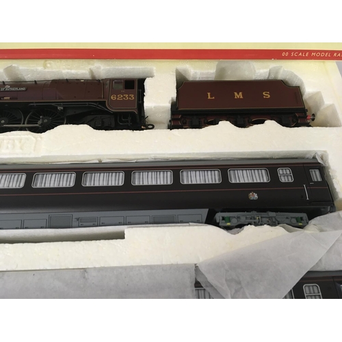 72 - A boxed Hornby set THE ROYAL TRAIN R2370 includes locomotive and tender together with three coaches.... 