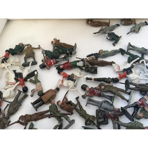 723 - A collection of approximately 120 metal toy soldiers by BRITAINS CRESCENT and others. Features a var... 