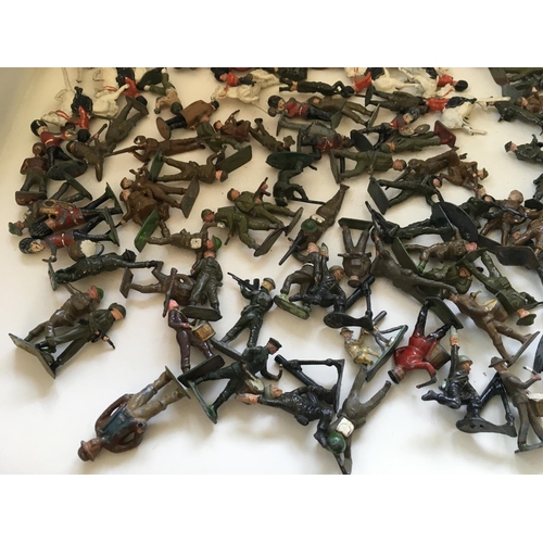 723 - A collection of approximately 120 metal toy soldiers by BRITAINS CRESCENT and others. Features a var... 