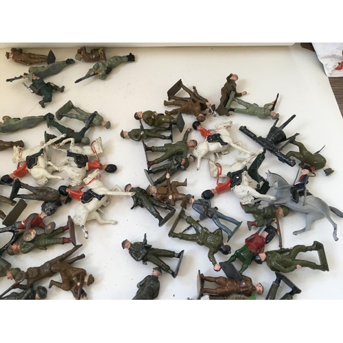 723 - A collection of approximately 120 metal toy soldiers by BRITAINS CRESCENT and others. Features a var... 