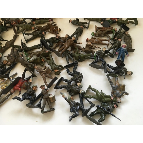 723 - A collection of approximately 120 metal toy soldiers by BRITAINS CRESCENT and others. Features a var... 