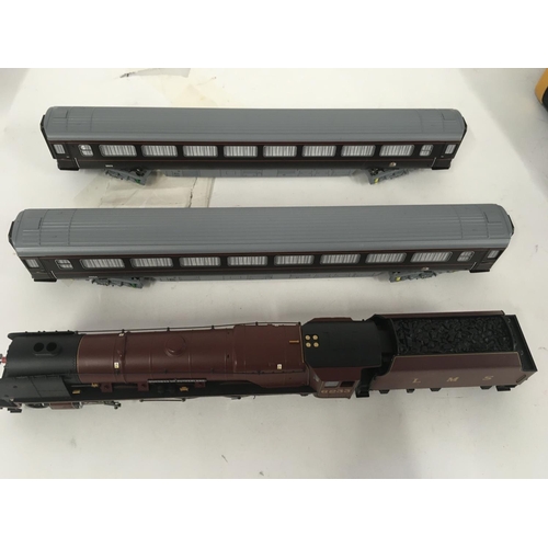 74 - Unboxed Hornby model locomotive Duchess of Sutherland with tender and two royal coaches