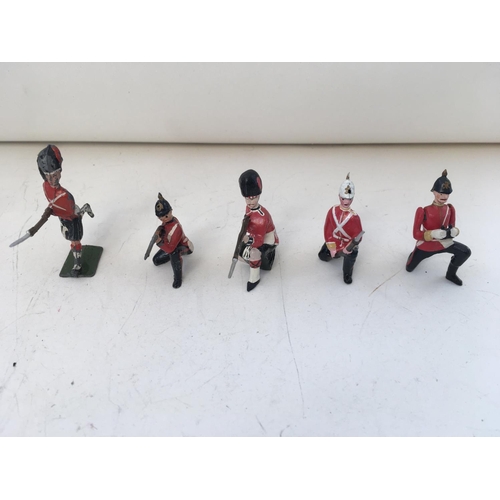 746 - A collection of 30 metal soldiers mainly Britains. Features differing regiments eras and stances.