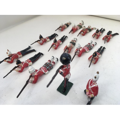 746 - A collection of 30 metal soldiers mainly Britains. Features differing regiments eras and stances.