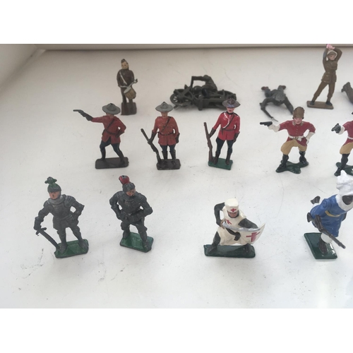 748 - A collection of 25 metal figures by Britains and others. All military themed.