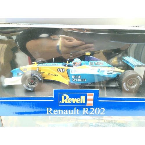 769 - 4 Boxed Diecast F1 Cars. Including Hot Wheels and Revell 1:18 Scale. (4).