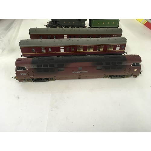 78 - An unboxed pair of locomotives Hornby Western Invader D1009 weathered edition with 2 coaches. A Lima... 