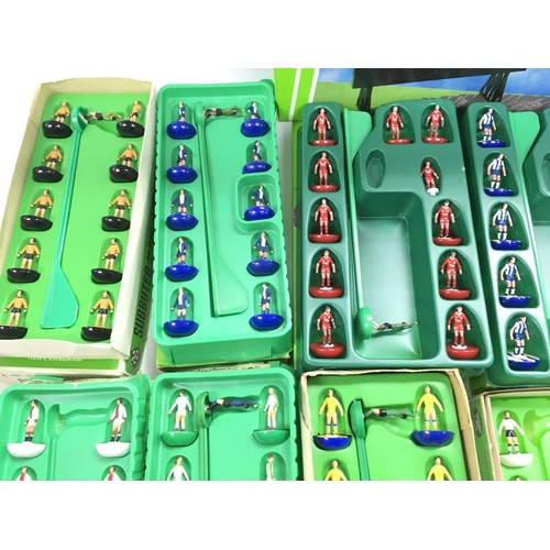 8 - A Collection of 9 Boxed Subbuteo Teams. And a Boxed Score Board.