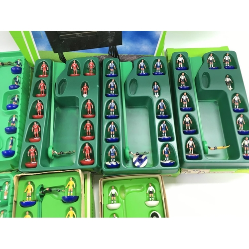 8 - A Collection of 9 Boxed Subbuteo Teams. And a Boxed Score Board.