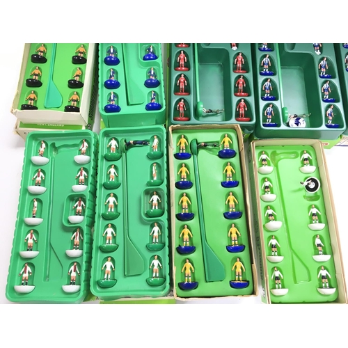 8 - A Collection of 9 Boxed Subbuteo Teams. And a Boxed Score Board.