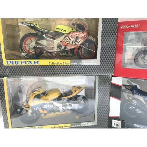 811 - A Collection of 4 Boxed Diecast Motorcycles including Protar Guiloy and Minichamps.(4).