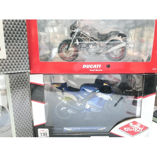 811 - A Collection of 4 Boxed Diecast Motorcycles including Protar Guiloy and Minichamps.(4).