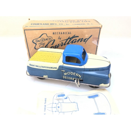 819 - A Boxed Tin plate Wind Up Walt Reach Toy Decorators Truck.