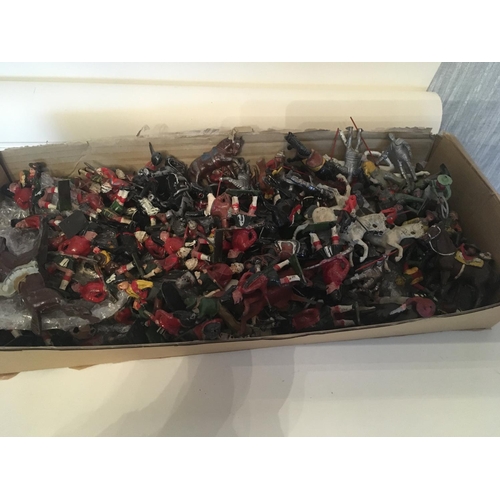 831 - A box containing a large selection of metal models by Britains and others. Figures include soldiers,... 