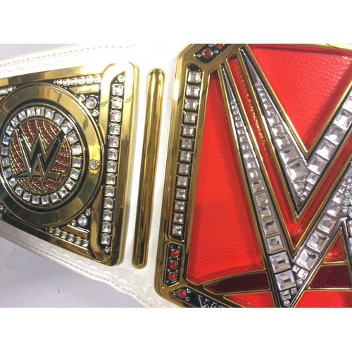 849 - A WWE Raw Womens Championship Replica Title Belt. Full size with Adjustable Fastener Strap. With Rhi... 