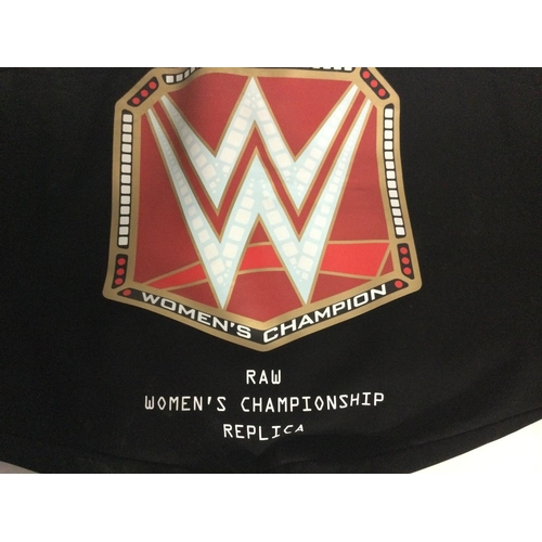 849 - A WWE Raw Womens Championship Replica Title Belt. Full size with Adjustable Fastener Strap. With Rhi... 