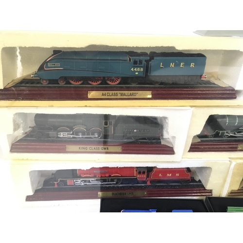 877 - A collection of 11 ATLAS model railway engines 10 in original packaging .