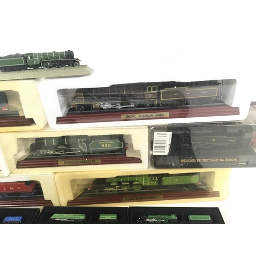 877 - A collection of 11 ATLAS model railway engines 10 in original packaging .