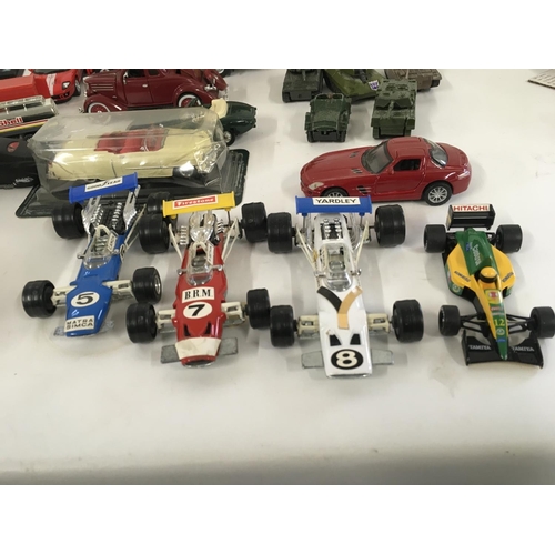 879 - A collection of model vehicles by assorted manufacturers both boxed and Playworn, includes some mili... 