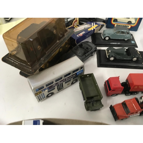 879 - A collection of model vehicles by assorted manufacturers both boxed and Playworn, includes some mili... 