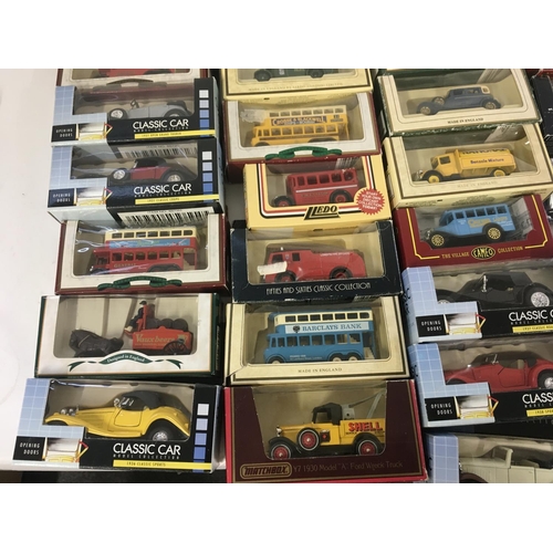 882 - A collection in excess of 60 model cars by a variety of manufacturers mostly in original packaging