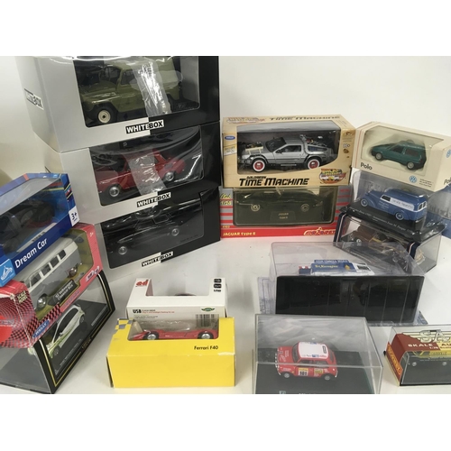 883 - A collection of 16 model vehicles by different manufacturers all in original packaging.