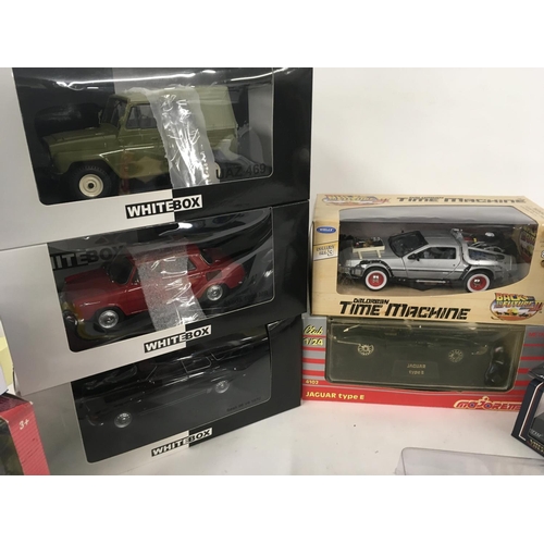 883 - A collection of 16 model vehicles by different manufacturers all in original packaging.