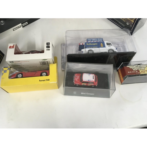 883 - A collection of 16 model vehicles by different manufacturers all in original packaging.